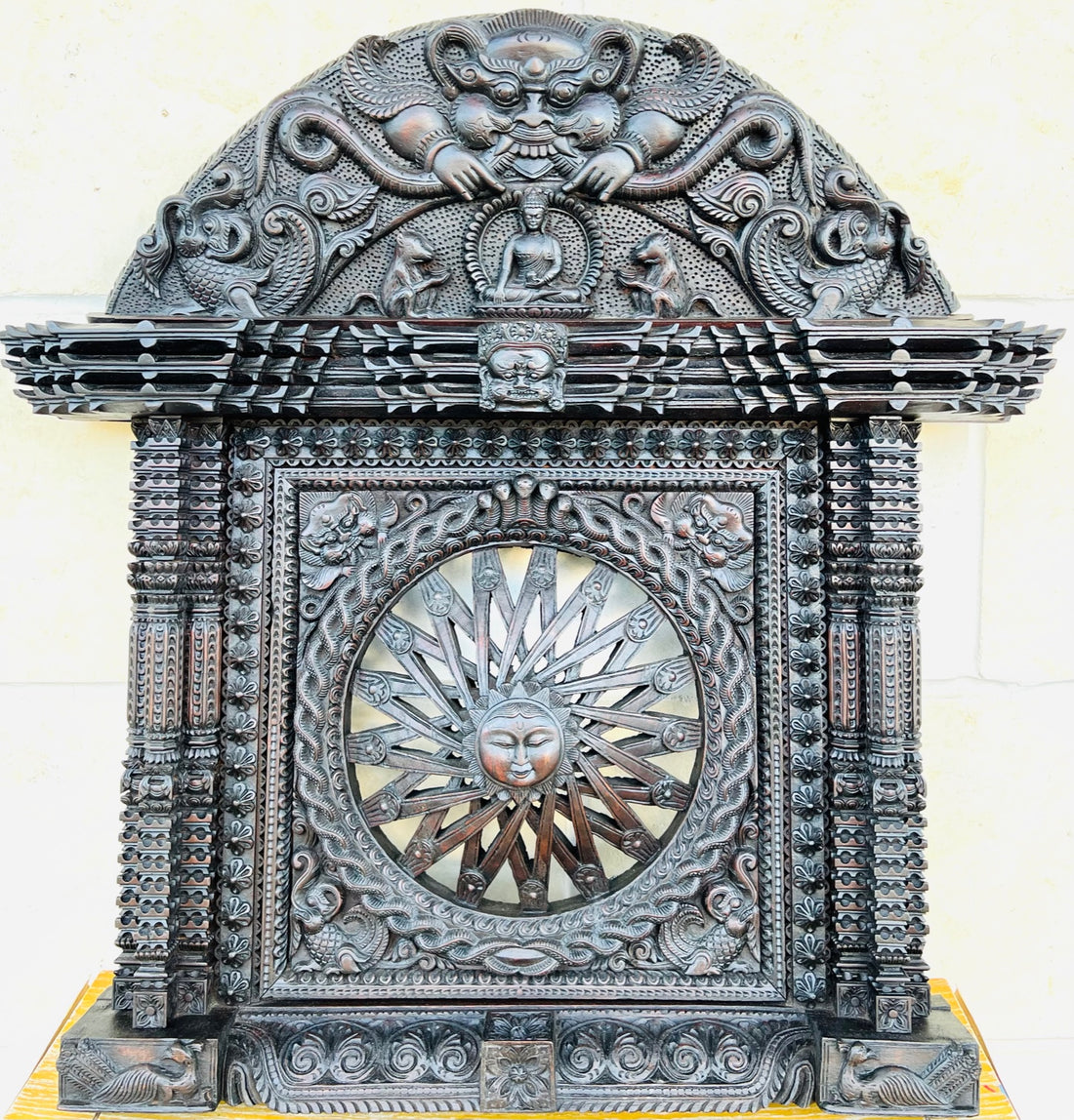 Surya Mukhi Ankhi Jhayal, a dome carved with Bhairav, and Buddha. The center of the window is carved with sun dome and a coiled snake around it.